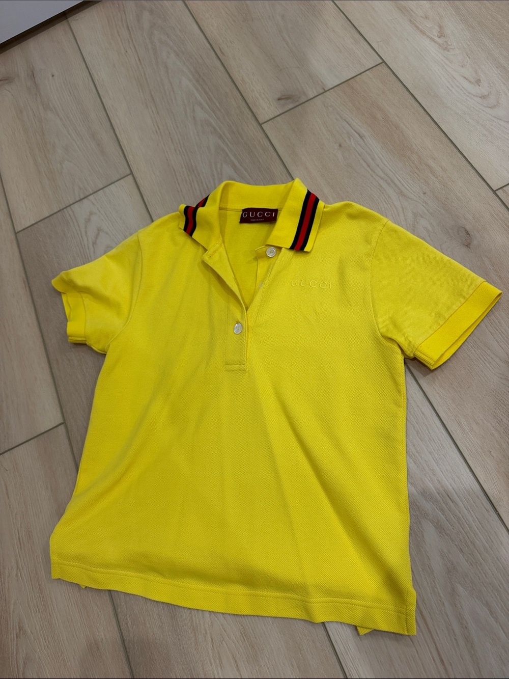 Gucci yellow polo with red stripe at collar